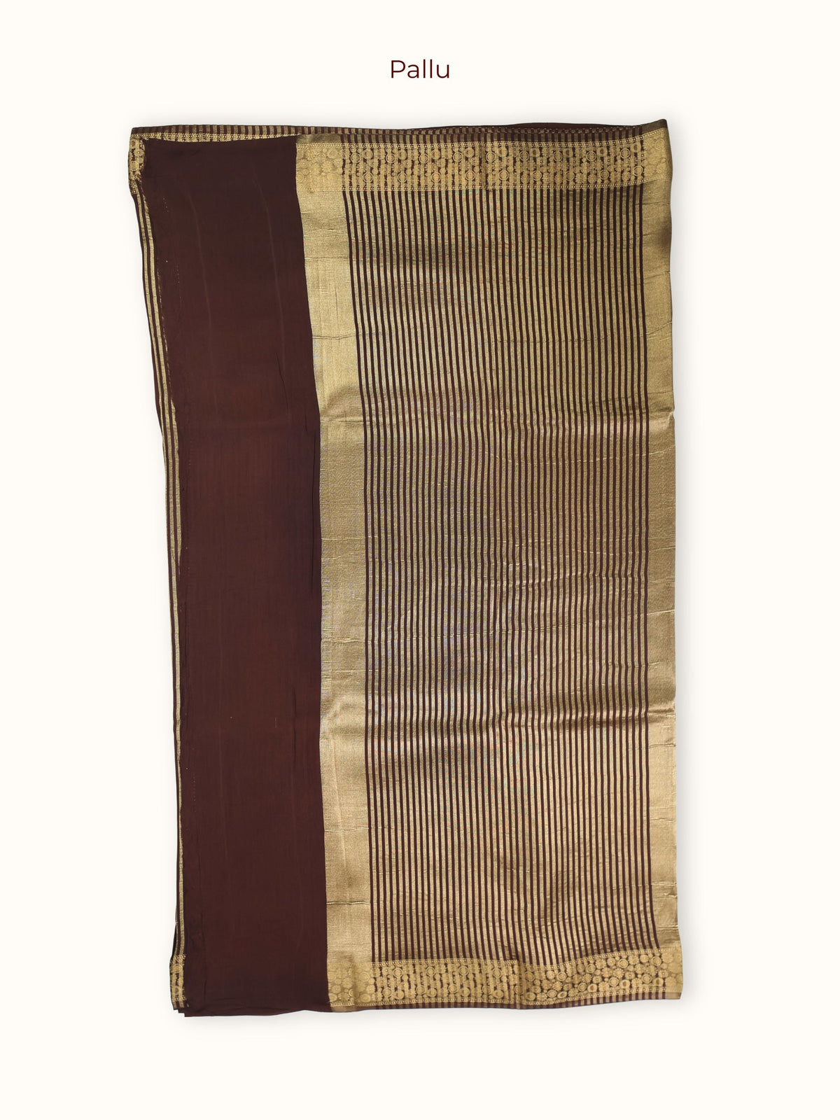 The pallu, fine gold stripes framed by a band of round florals