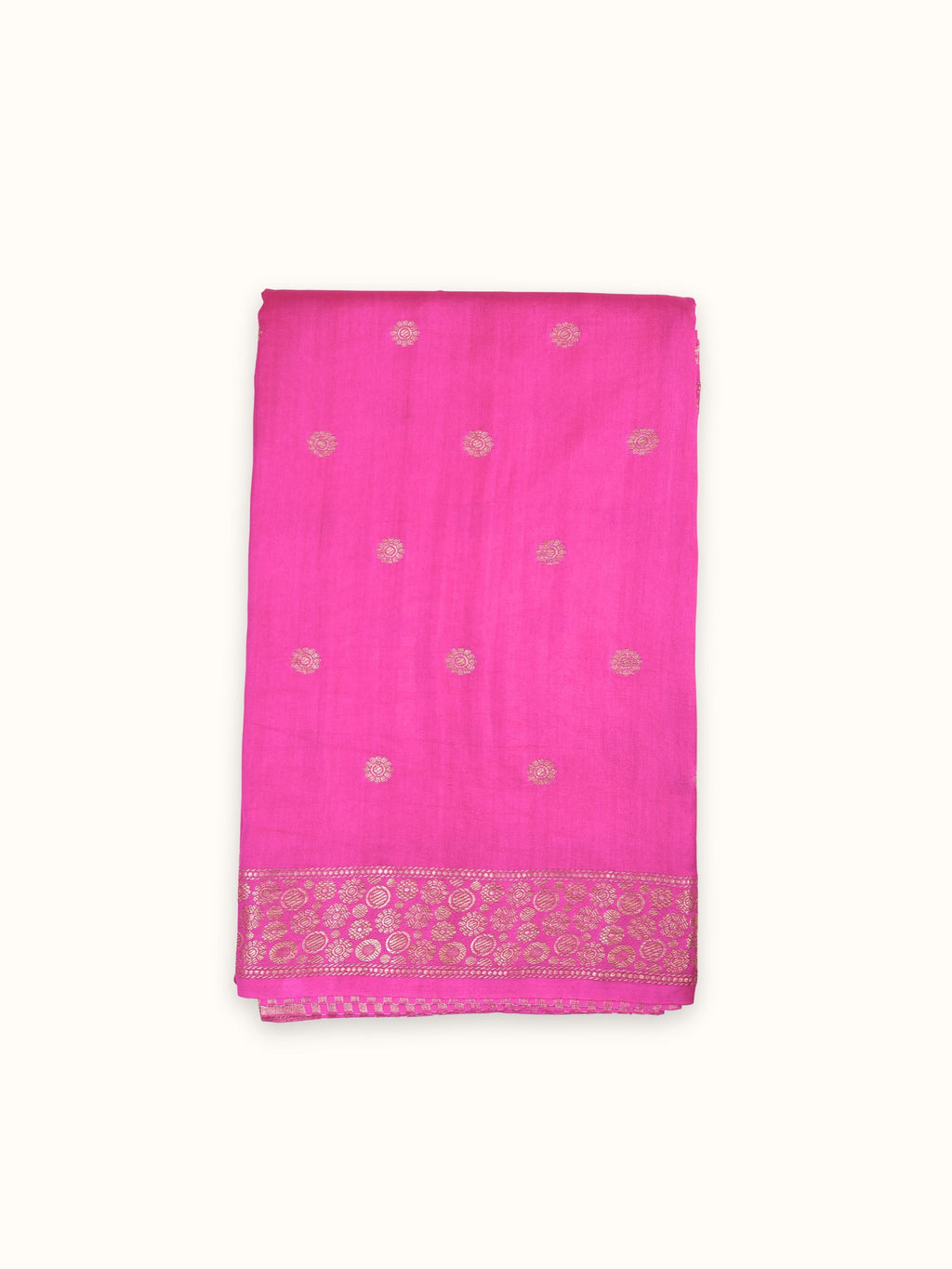 Fuchsia pink Chiniya silk saree folded, gold coin butis