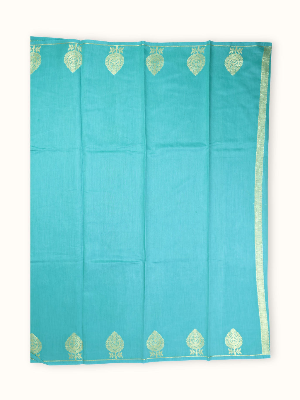The saree spread flat, gold cones widely spaced on an open body