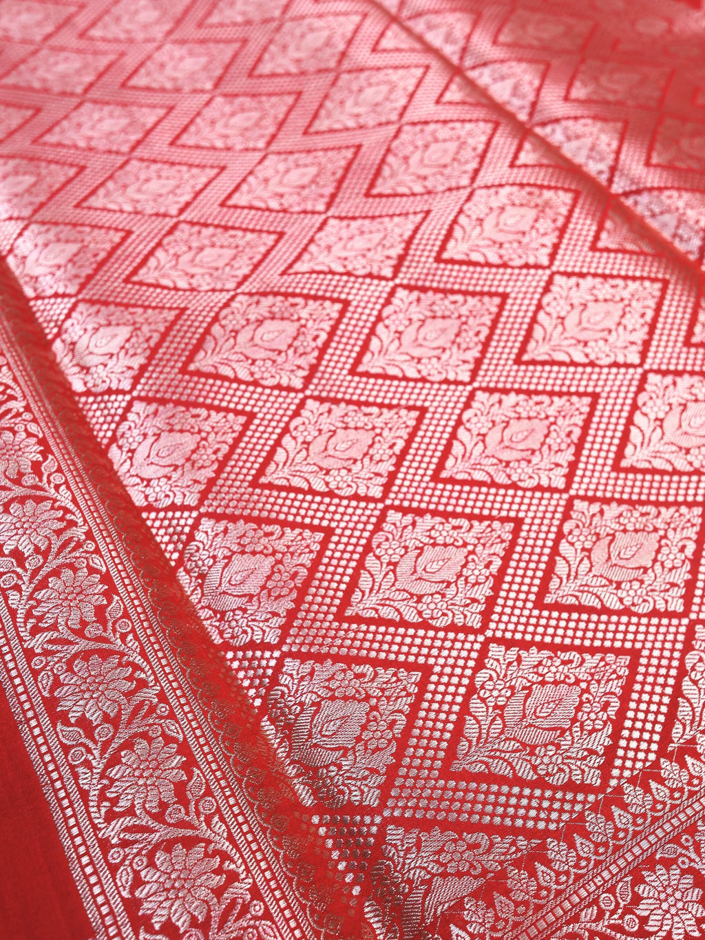 Close detail of the silver zari lattice and floral border