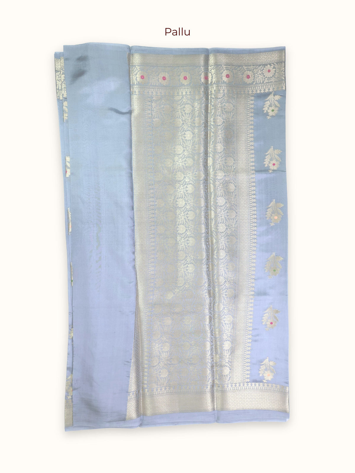The pallu, bands of gold and silver with a vine of flowers