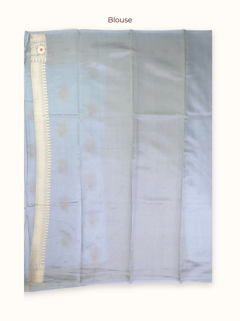 The unstitched blouse piece in powder blue with gold zari