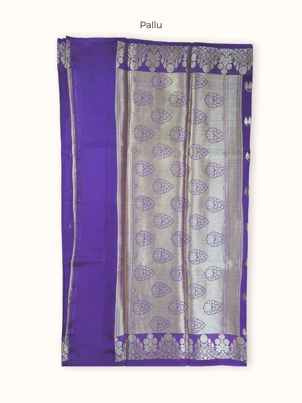 The pallu, large silver paisleys in rows closed with chevrons