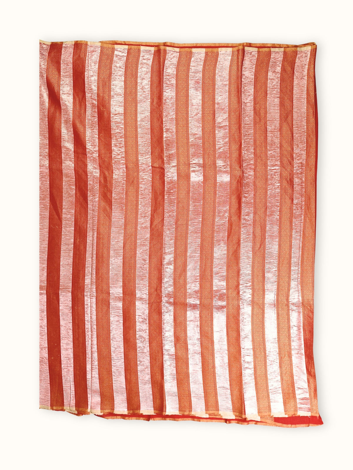 Saree laid open, red and silver stripes down the body