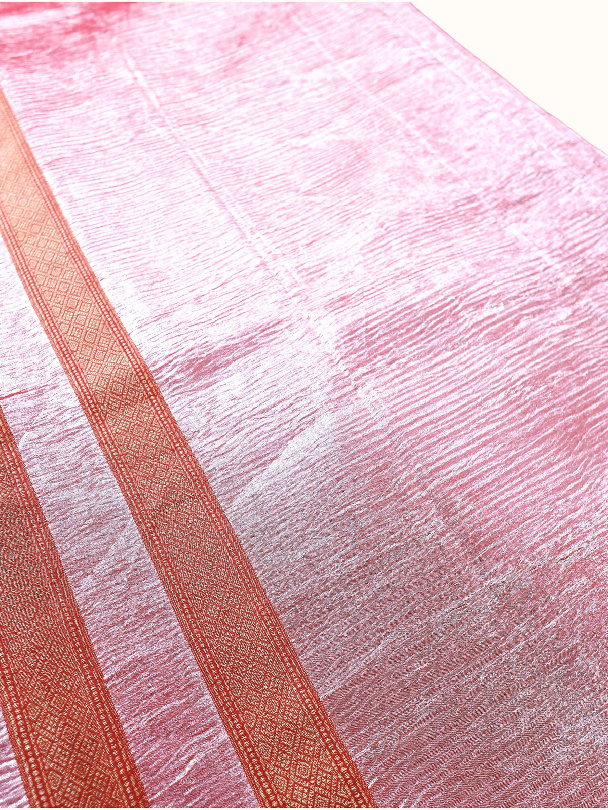 Crinkled silver tissue and diamond-woven stripe in close detail