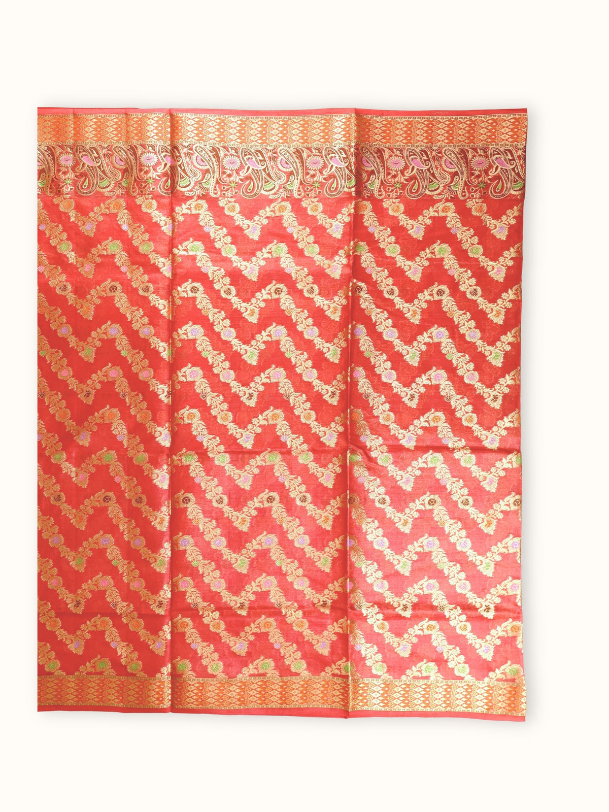 Saree laid open, gold vines in a zigzag across the body