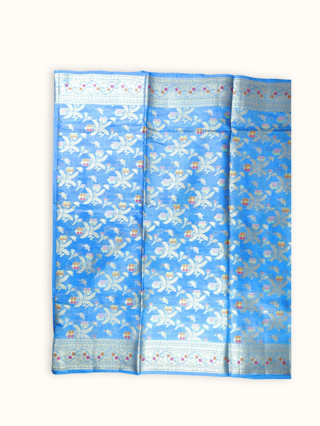Saree laid open, leaf sprays across the body