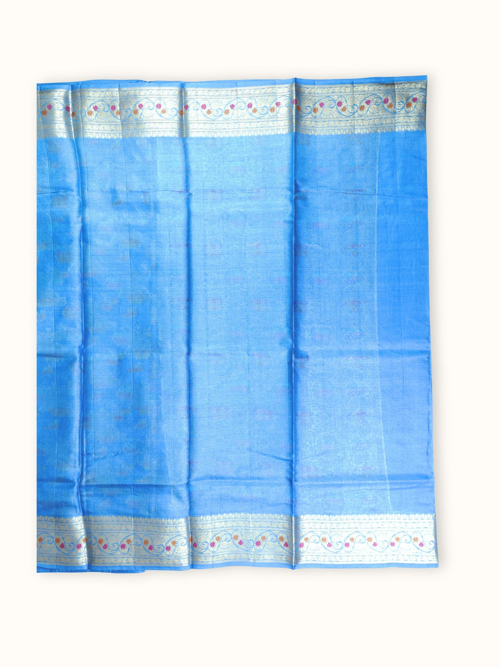 Plain blue blouse piece with a floral border