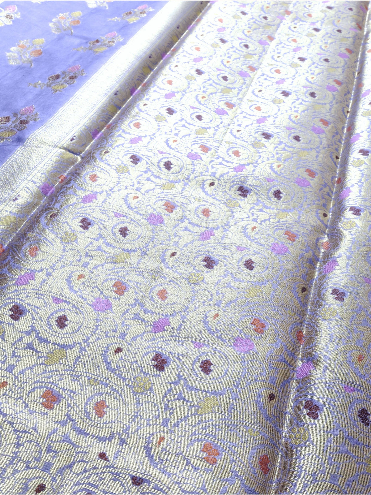 Paisleys and meena flowers of the pallu in close detail
