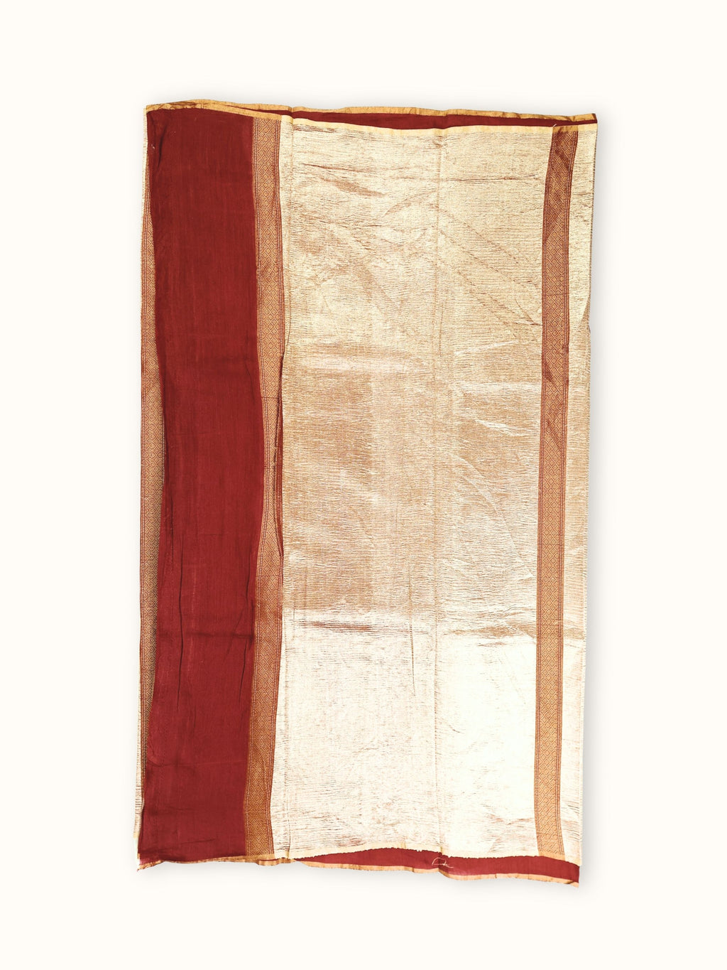 Wide gold tissue pallu with a plain maroon end