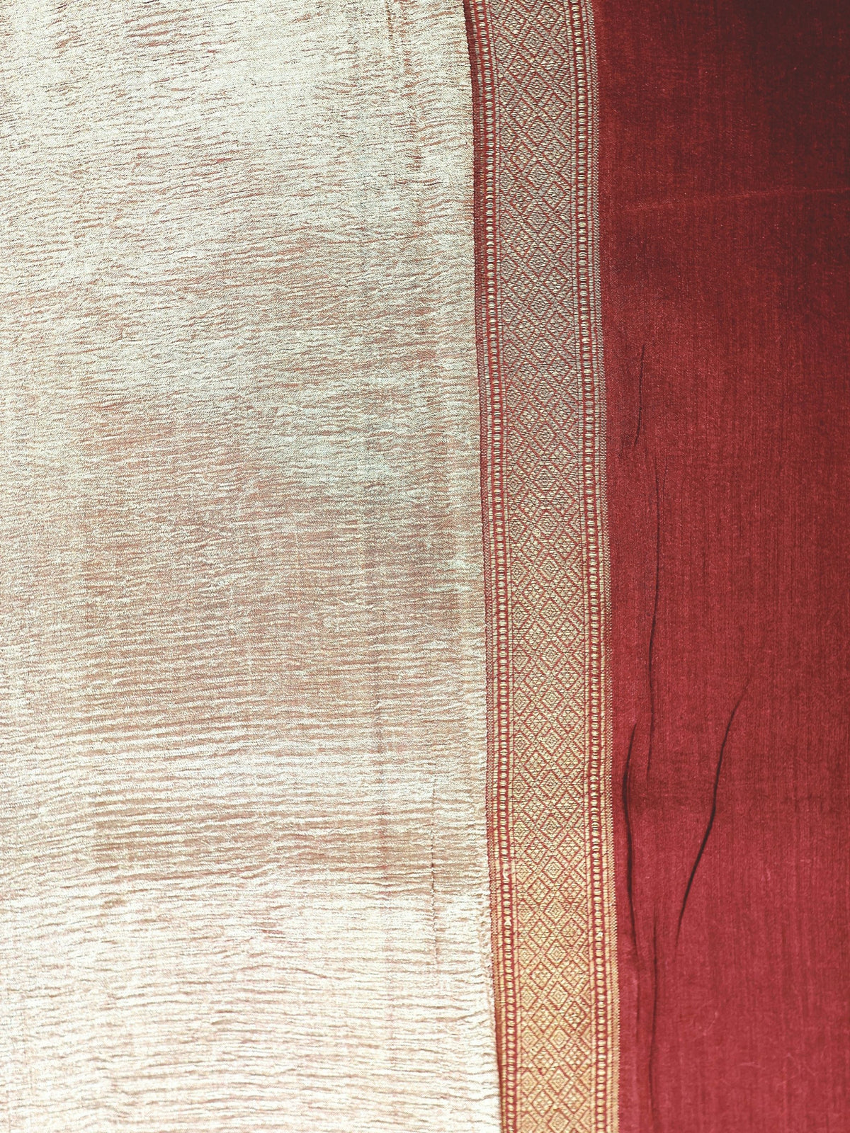 Gold tissue and diamond-woven border in close detail