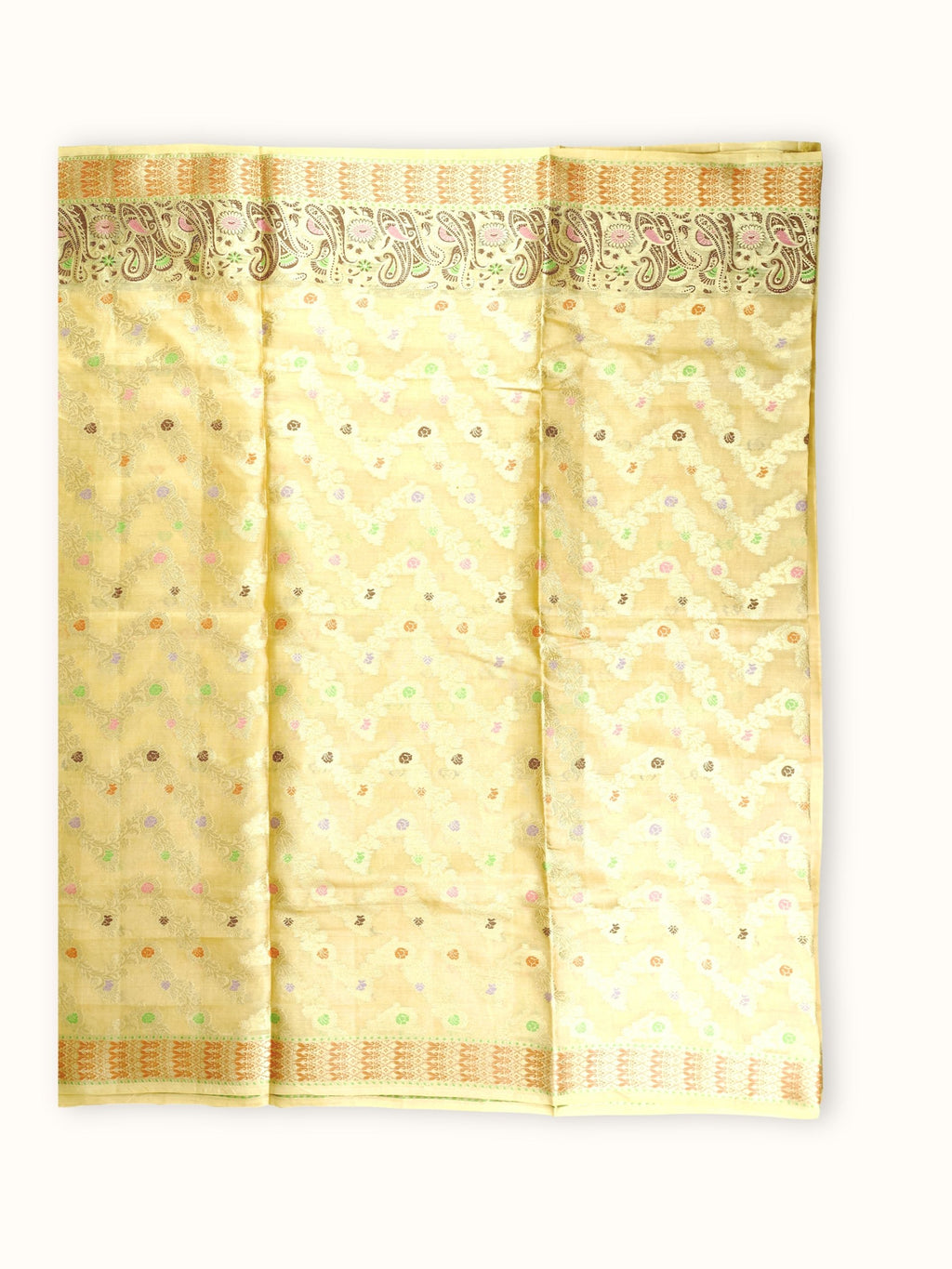 Saree laid open, gold vines and small flowers across the body