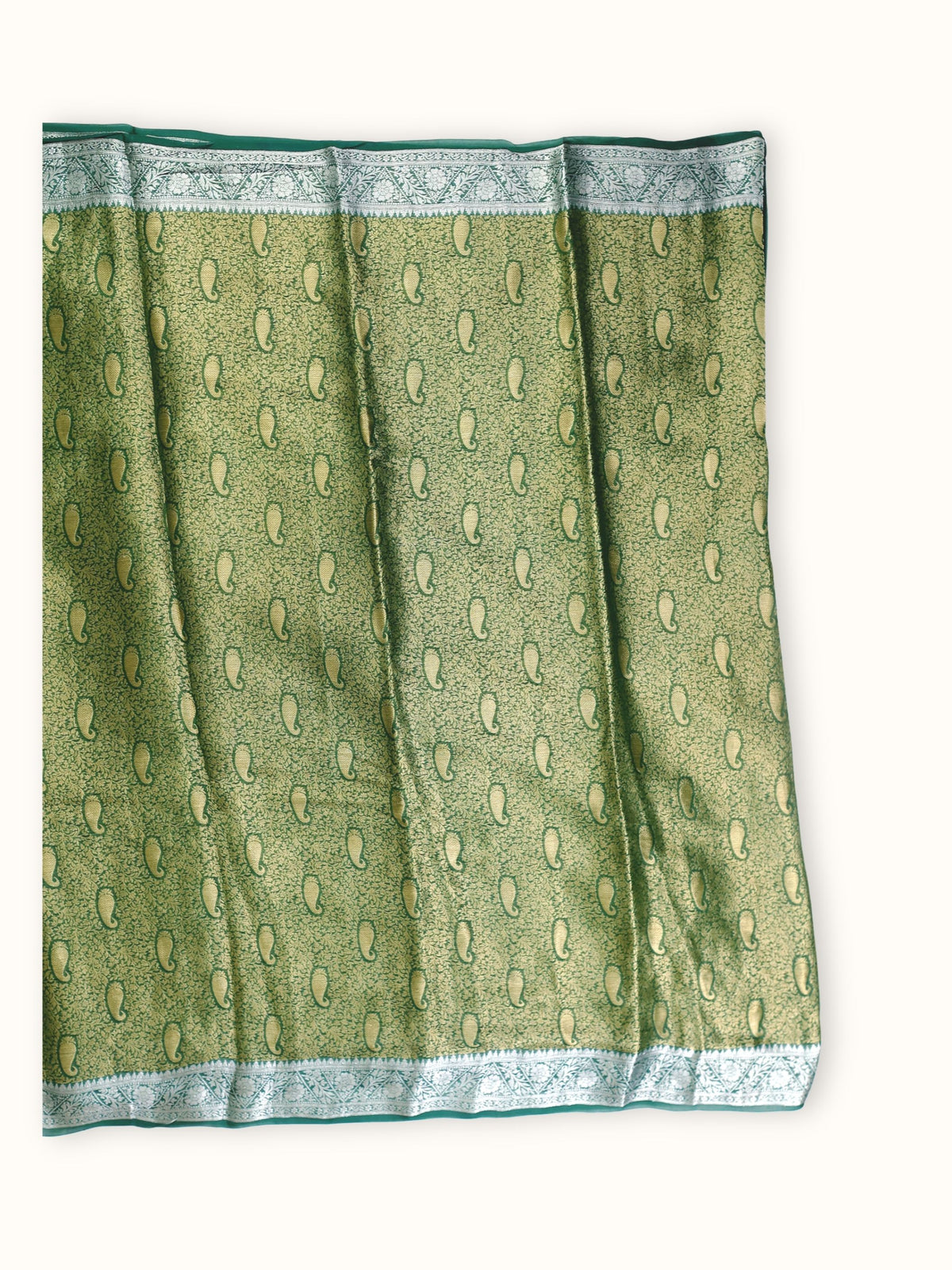 Saree laid open, gold paisleys across the body