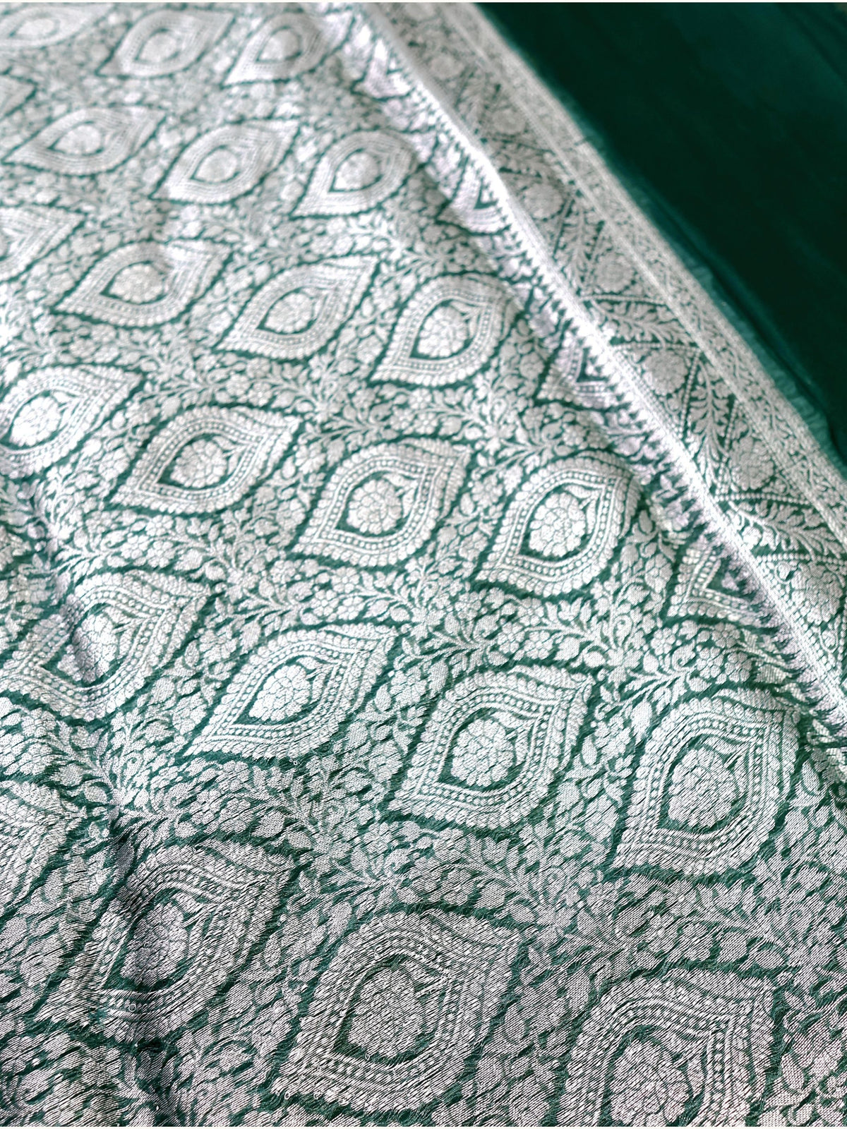 Silver leaf medallions of the pallu in close detail